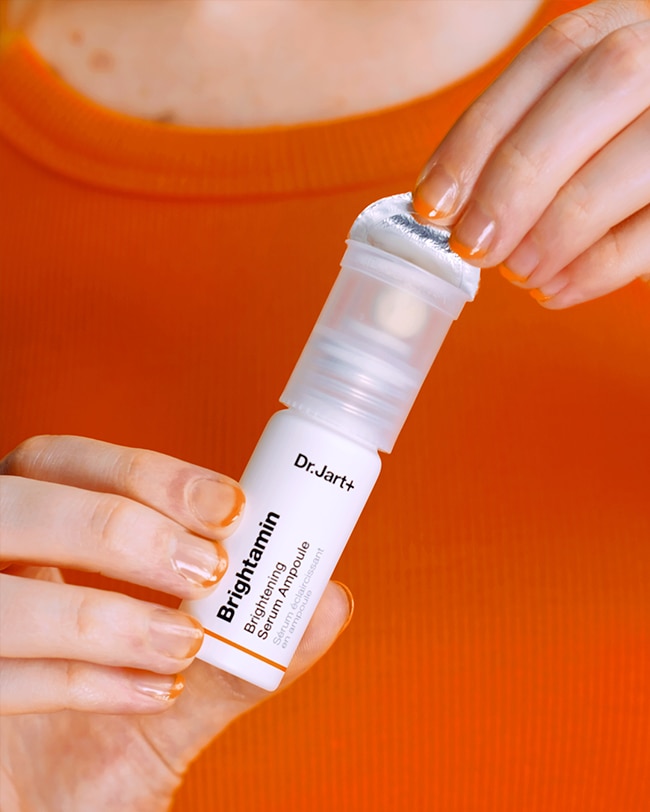 Container of brightamin serum includes vitamin c-infused ball to activate the fresh serum.