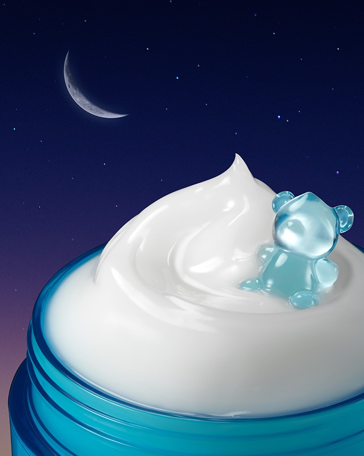 Jelly bear sits lightly on the smooth and light night mask formula in an open jar