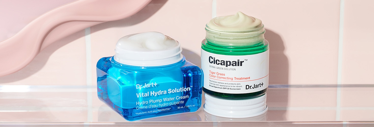 Open jars of Vital Hydra Solution Glow Moisturizer and Cicapair Color Corrector show creamy and smooth formulas