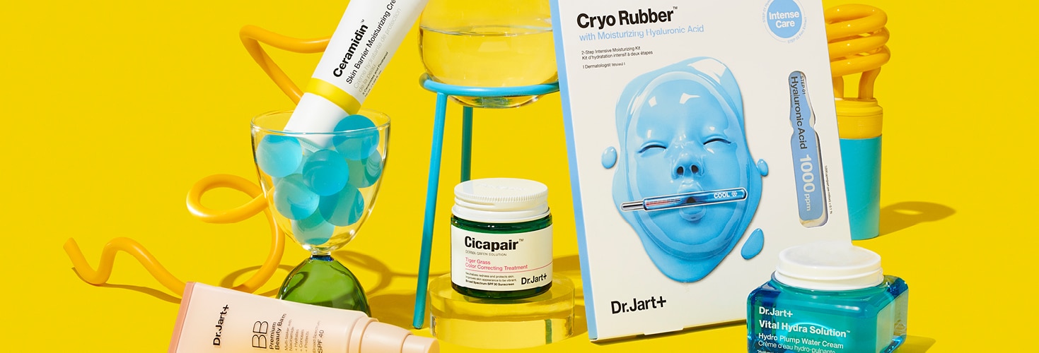 Dr.Jart+'s bestselling skincare products balanced on brightly colored science lab components with a cheery yellow backdrop. 