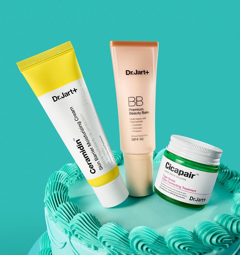Dr. Jart+ color correctors & moisturizer are displayed atop a birthday cake.