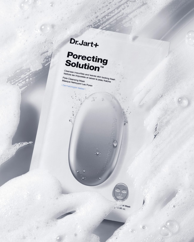 Dr.Jart+'s porecting face mask package is displayed among foam and bubbles.