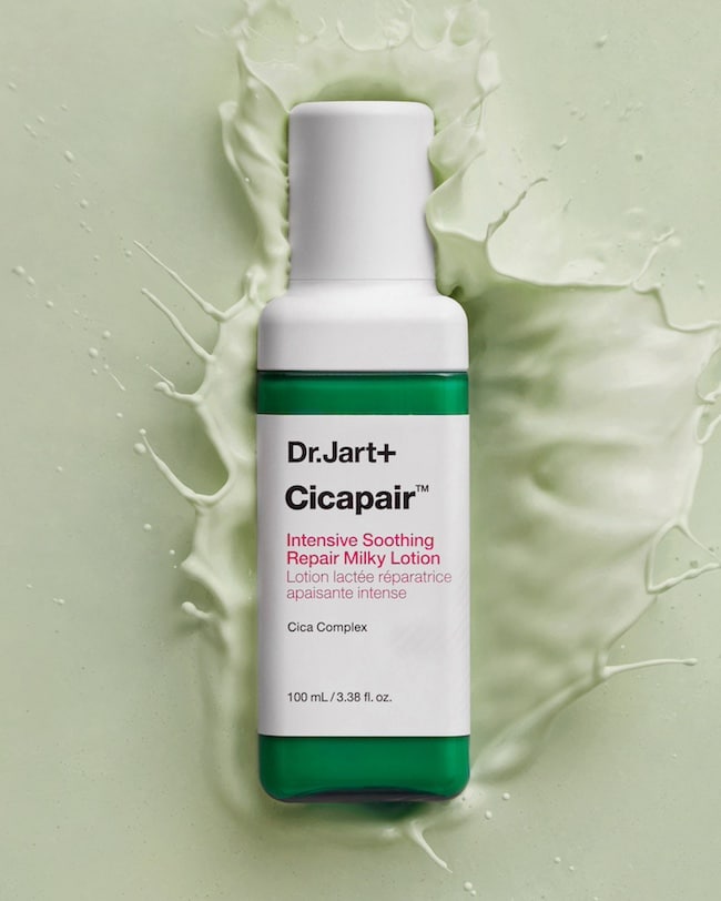 Bottle of Cicapair Milky Face Moisturizer Lotion splashes into the lightweight, fluid formula