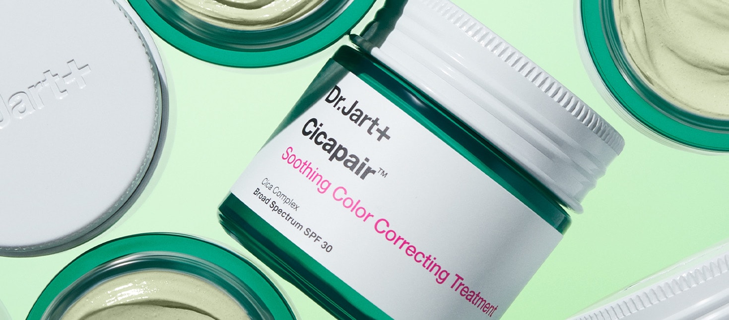 Close up of a jar of Cicapair Color Correcting Treatment reveals smooth green formula.