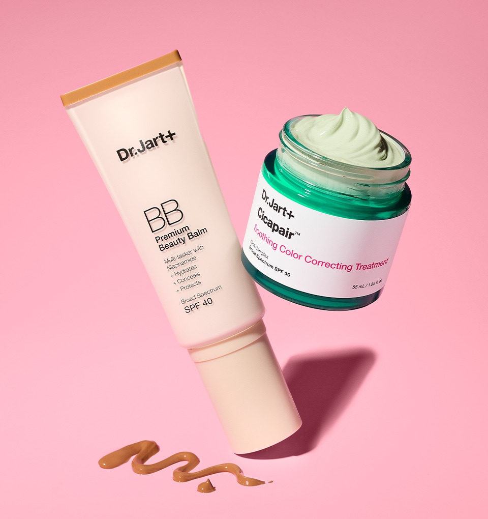 Dr.Jart+'s fan favorite color corrector & tinted moisturizer are positioned on a pink background with the BB Cream texture shown