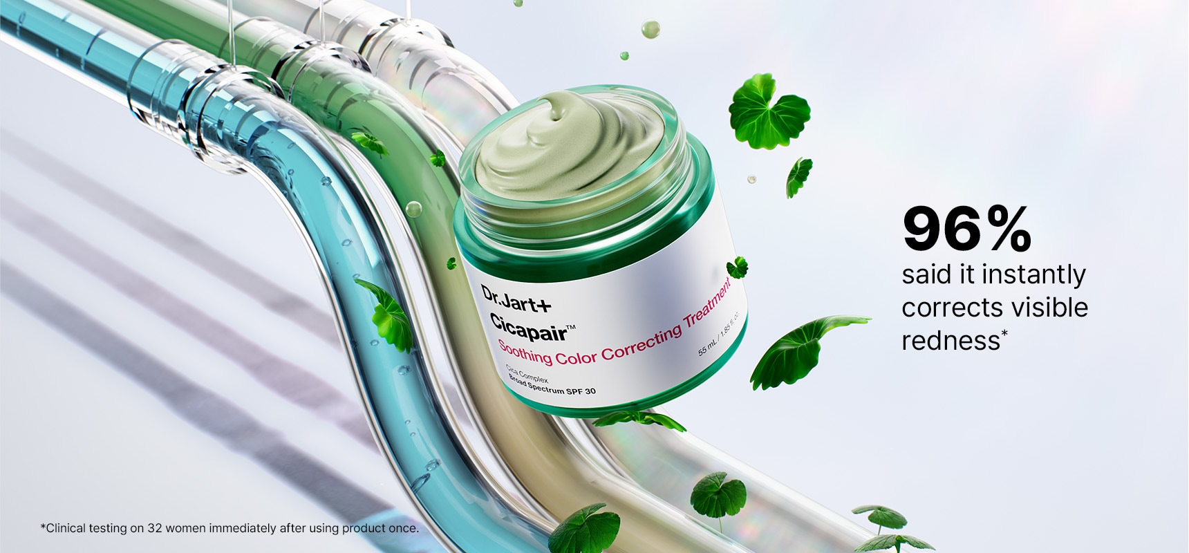 Jar of Cicapair color corrector floats among Centella leaves