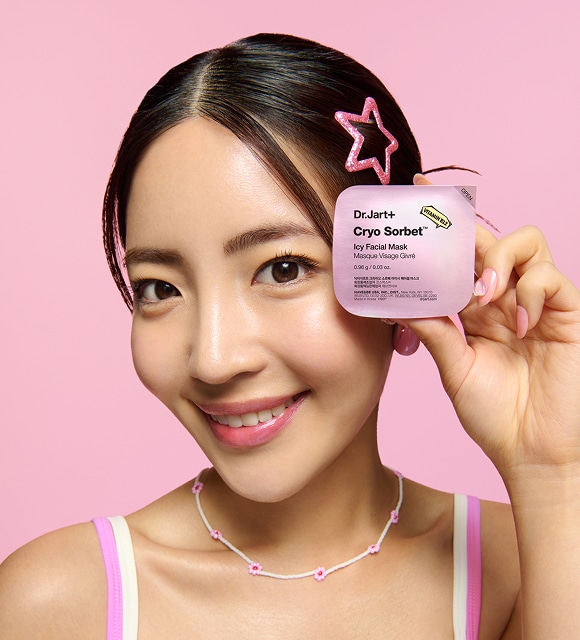 Woman in science lab applies Ceramidin Cream to skin