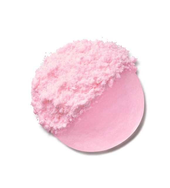 Woman smiles while applying a dollop of Ceramidin Moisturizer Cream to skin