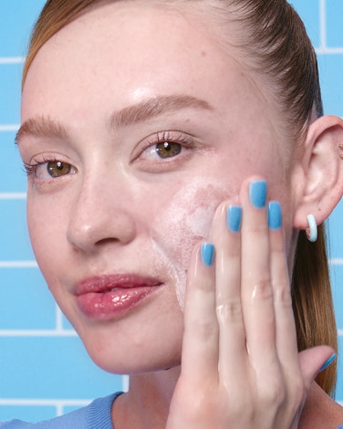 Ceramidin Moisturizer is shown floating amongst water droplets to depict hydration.
