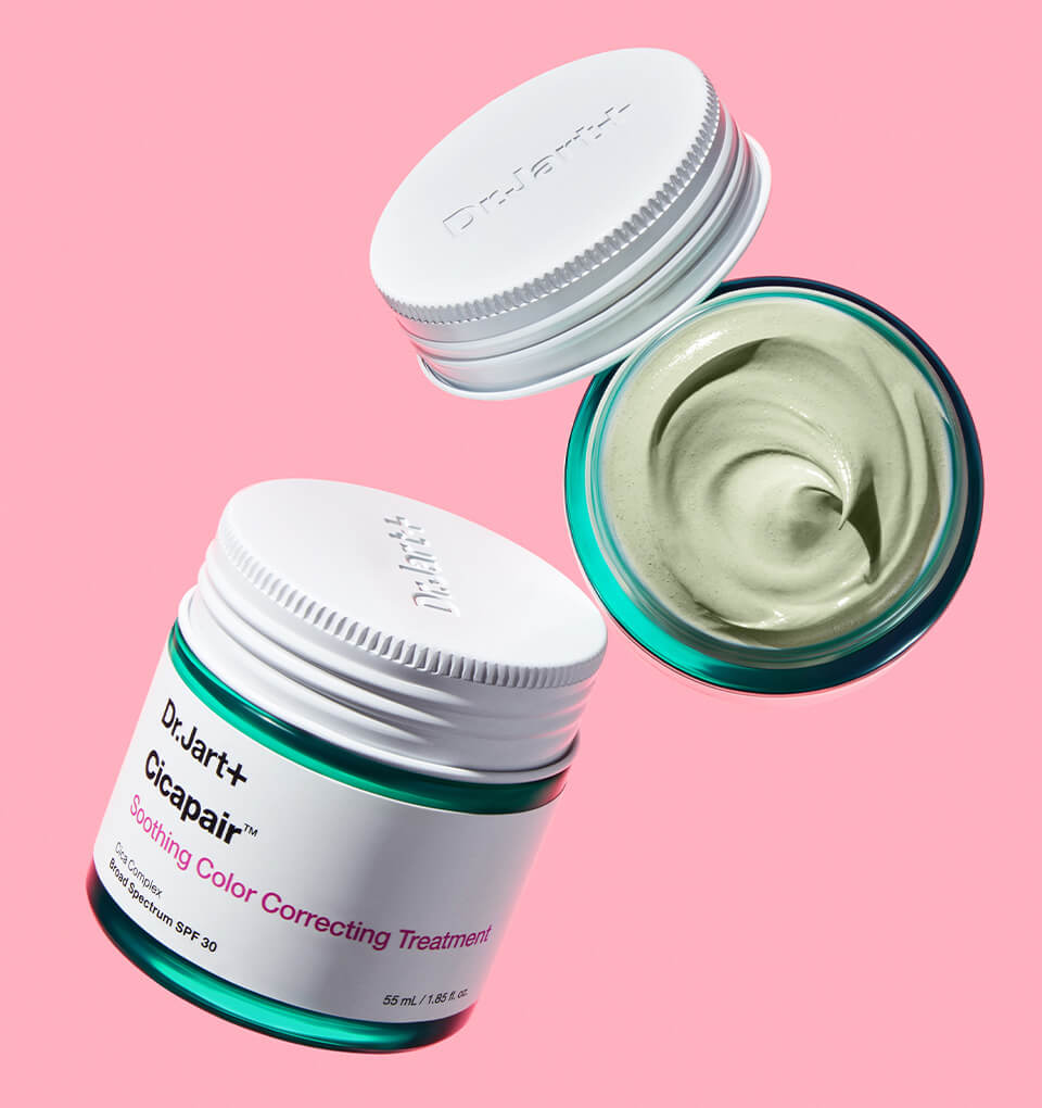 Dr. Jart+ Cicapair color corrector is displayed popping out of a travel bag. 