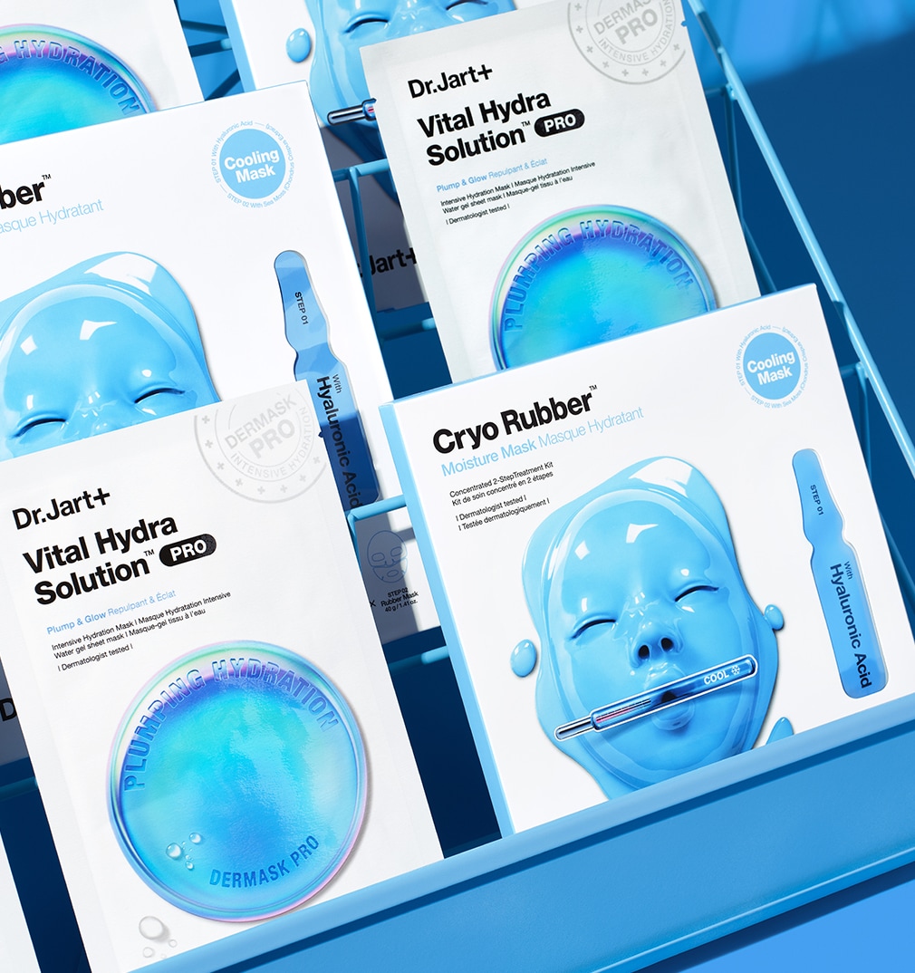 A variety of Dr.Jart+ Cryo Rubber & VHS face masks are assorted on a rack with blue background.