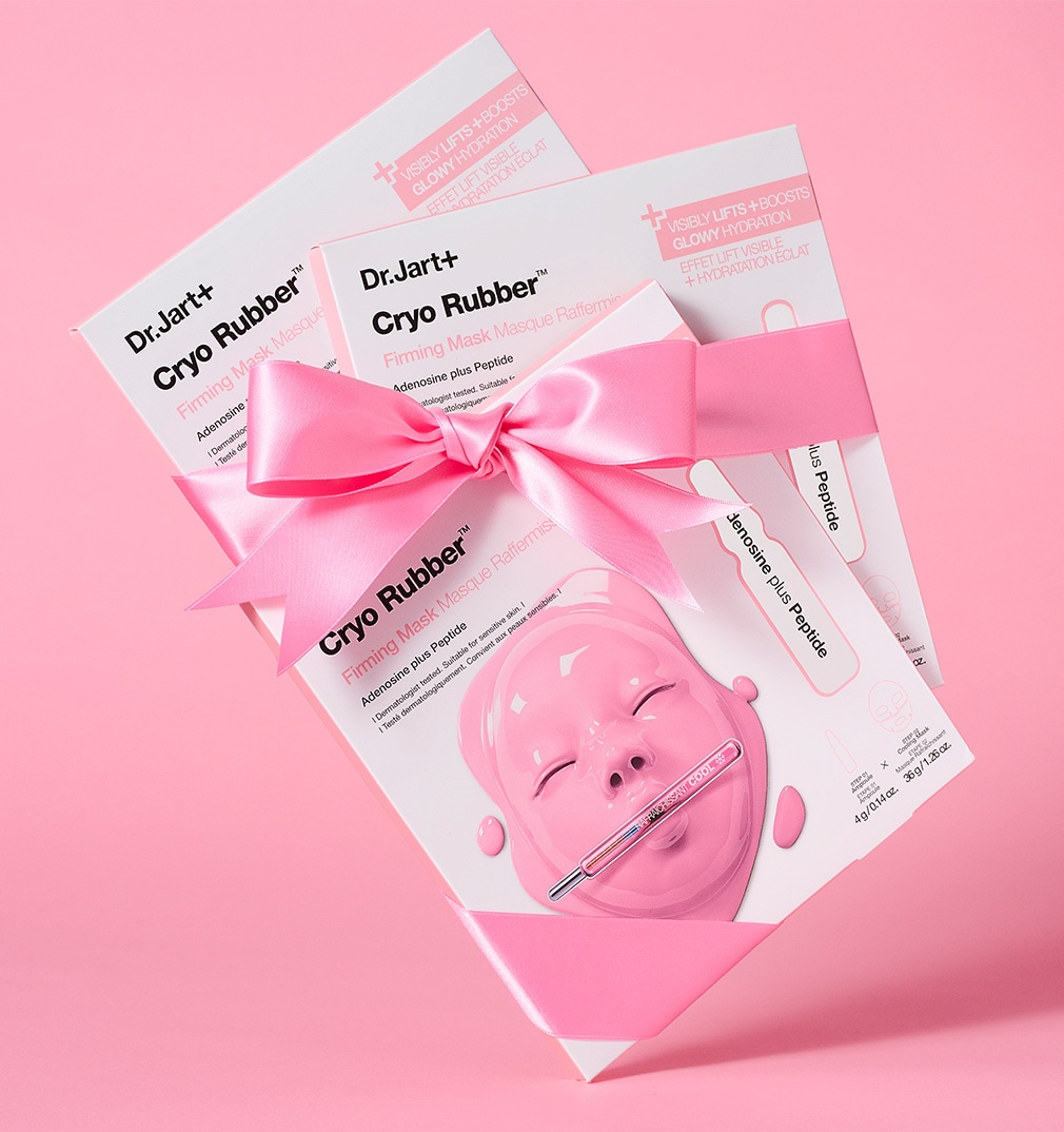 Cryo Rubber Collagen Face Mask package is displayed with serum ampoule packet among ice cubes.