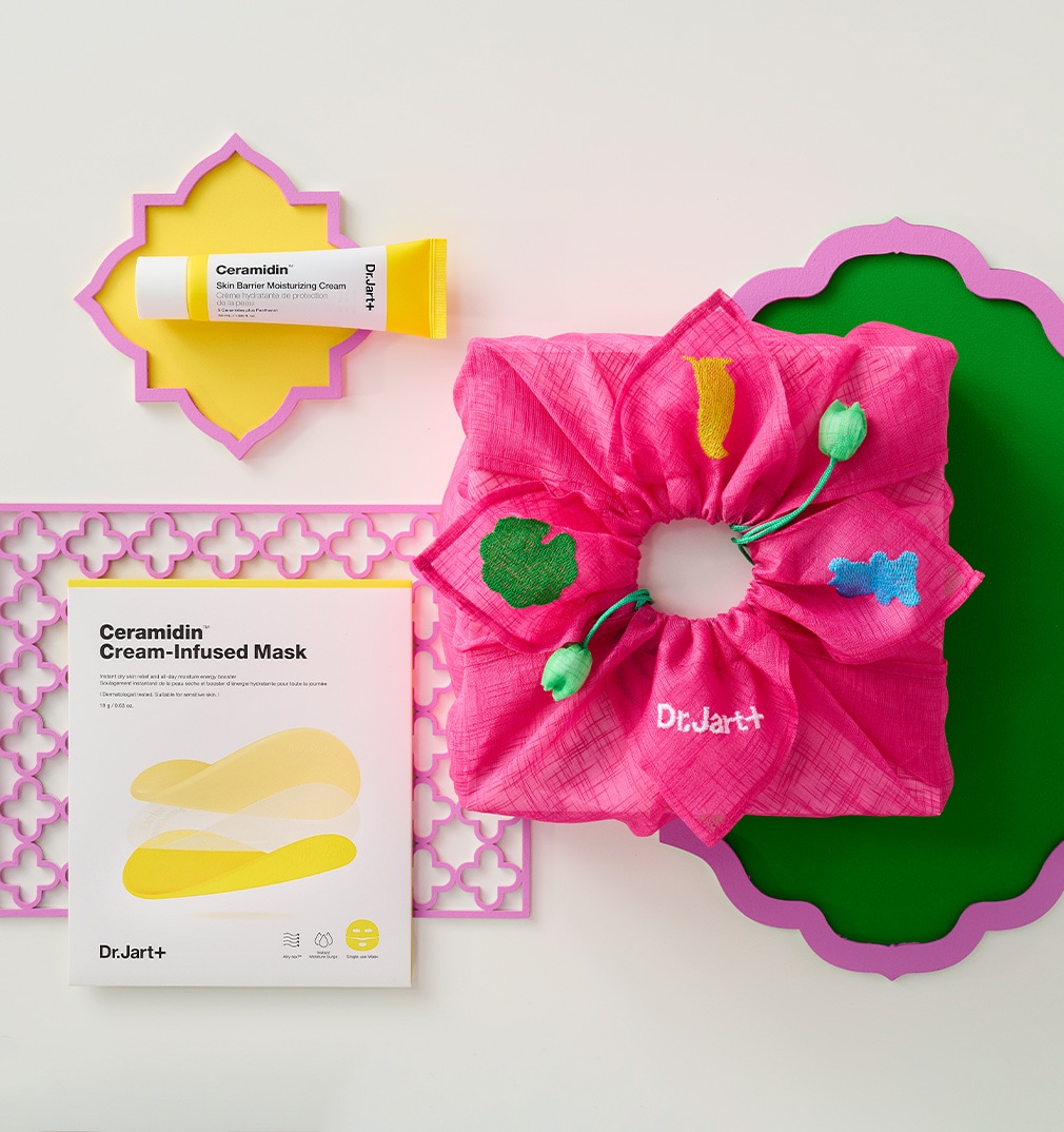 Box of Cicapair Redness Rescue Value Set balance on bright pink spokes.