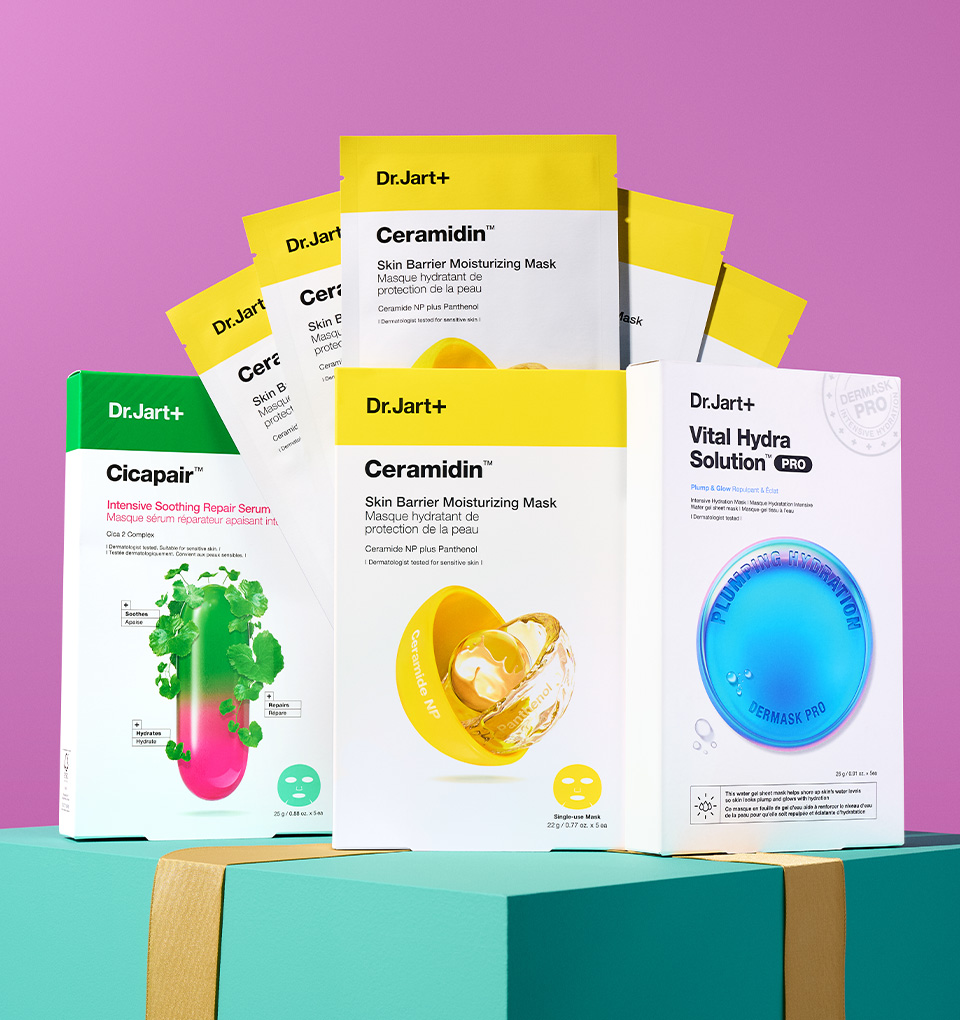 A korean skincare kit for redness & sensitive skin stand in front of a pink backdrop.