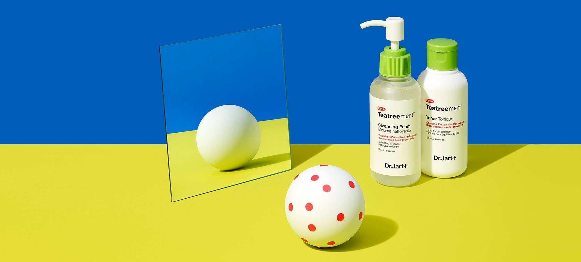 Teatreement cleanser and toner bottles on a bright background in front of a mirror