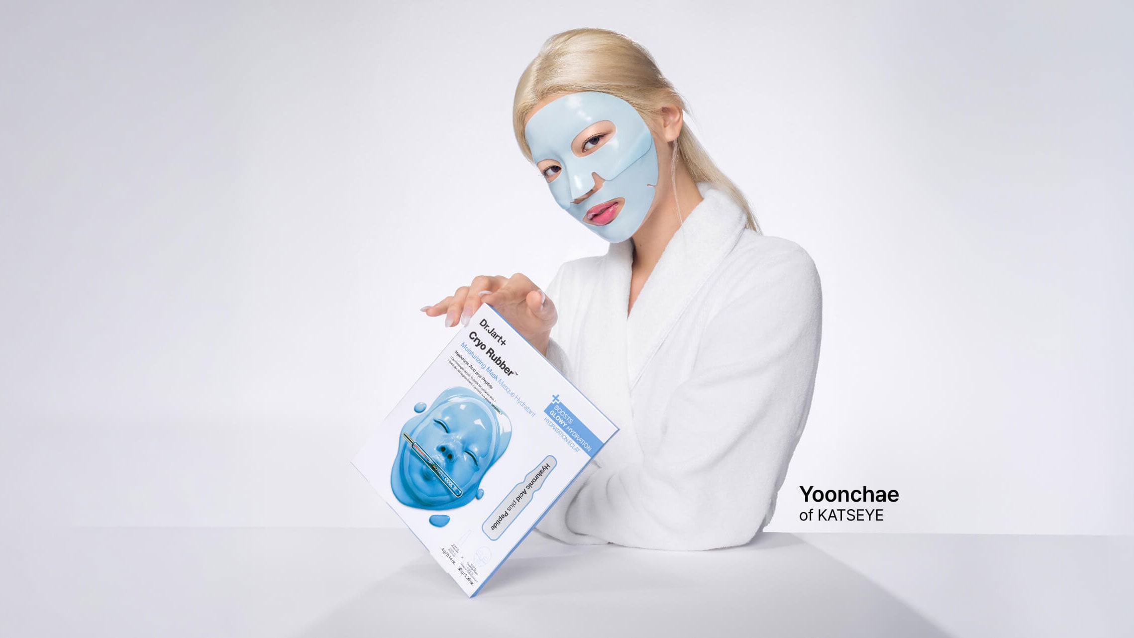 A variety of Dr.Jart+ Korean skincare face masks are laid out on brightly colored background, displayed on tilting shelves.