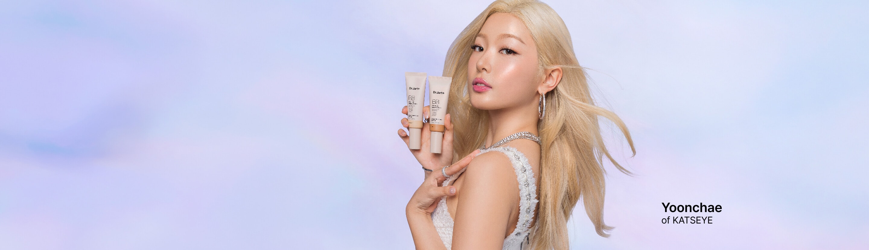 Dr.Jart+ face masks and a tube of Ceramidin Moisturizer Cream are balanced on a light blue podium