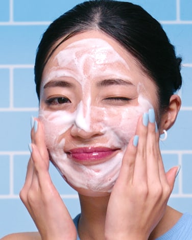 Ceramidin Moisturizer is shown floating amongst water droplets to depict hydration.